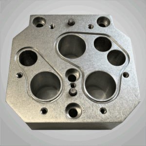 CNC aluminum machined part with bored holes and O-ring grooves